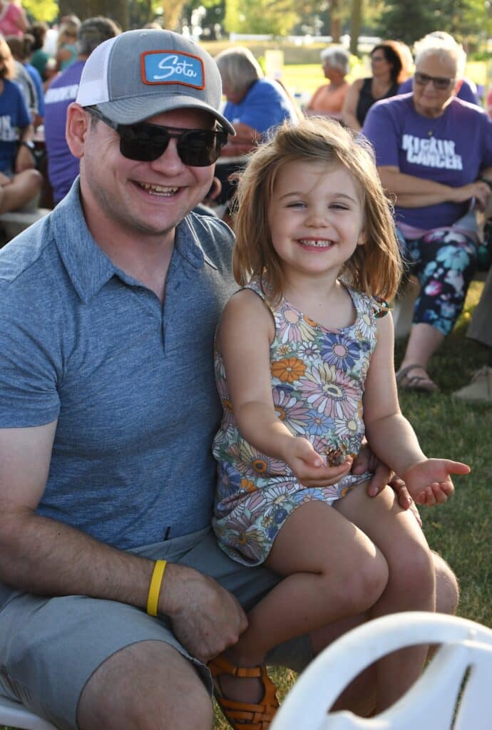 A man and little girl attend the 3rd Annual Kickin' Cancer Event.